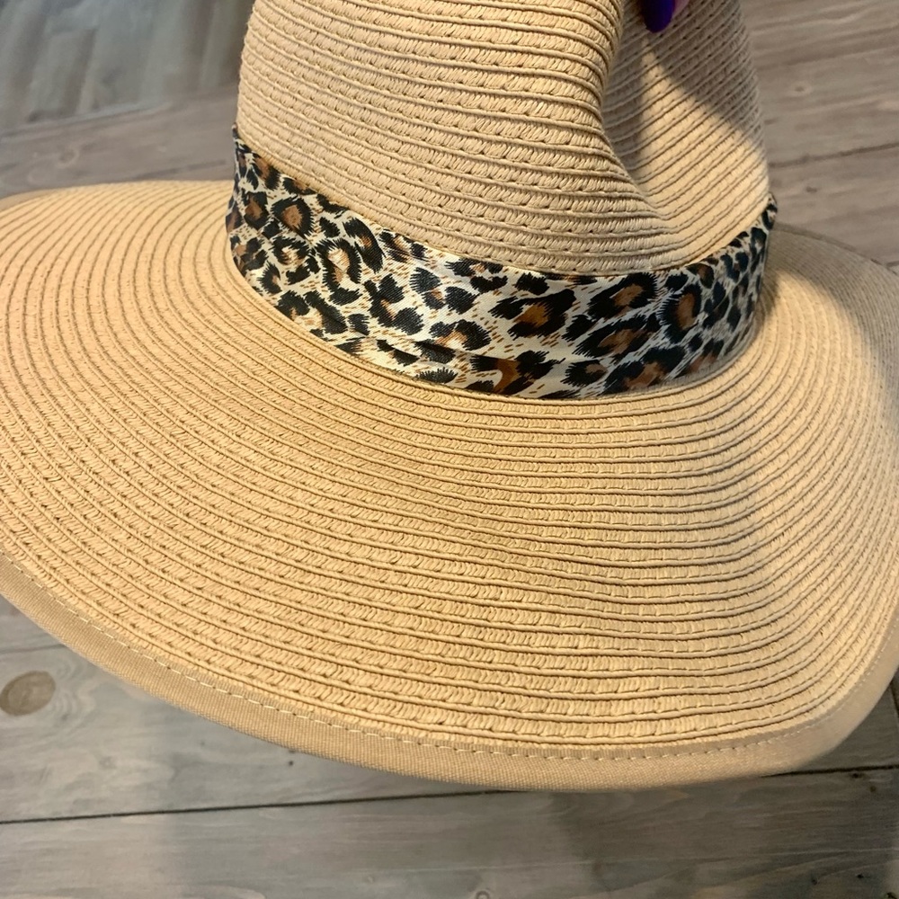Wide brim hat, leopard cloth trim and turned up back.